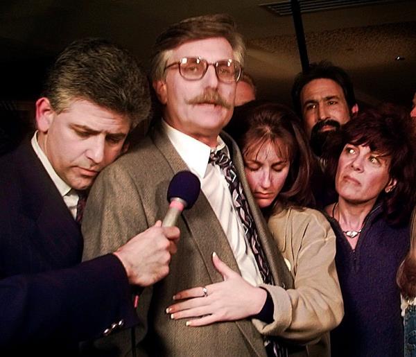 In this Feb. 4, 1997 file photo, Fred Goldman, center, is hugged by his attorney Daniel Petrocelli, left, and daughter Kim, as his wife Patti, right, looks on, following the verdict in the wro<em></em>ngful death civil suit against O.J. Simpson in Santa Monica, California
