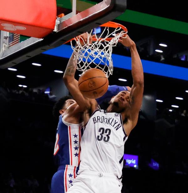 Brooklyn Nets guard Lo<em></em>nnie Walker IV shoots the ball against the 76ers on Tuesday night.