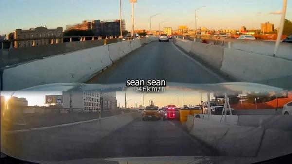Screenshot of video of rearview in car wher<em></em>e unmarked cop car is flashing lights. 