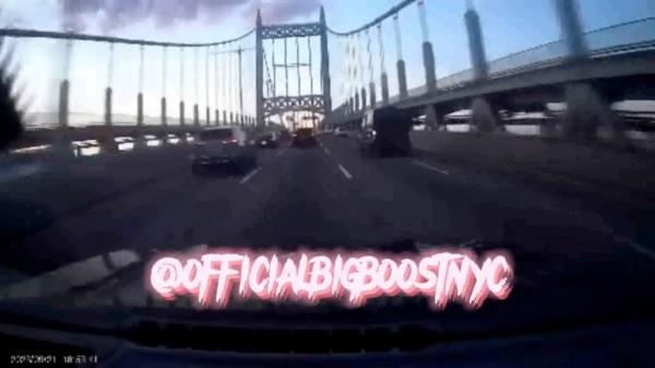 Screenshot of video of car driving over bridge in New York City with @officialbigboostnyc watermark