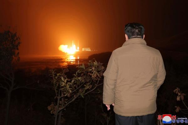  Kim Jong Un watching a missile test. 