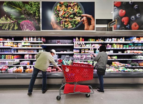 People shop in the food section of a retail store in Rosemead, California, on January 19, 2024.