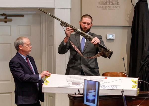 Chief prosecuting attorney Creighton Waters, left, asks Daniel Greene, a sergeant with the Colleton County Sheriff's Office to identify the 12-gauge shotgun presented as evidence.