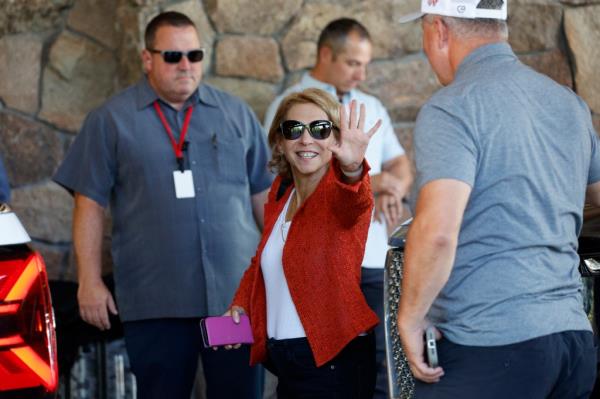 Shari Ellin Redstone, President of Natio<em></em>nal Amusements, waving as she arrives at the Allen & Co. Sun Valley Co<em></em>nference in Sun Valley, Idaho, with others in the background