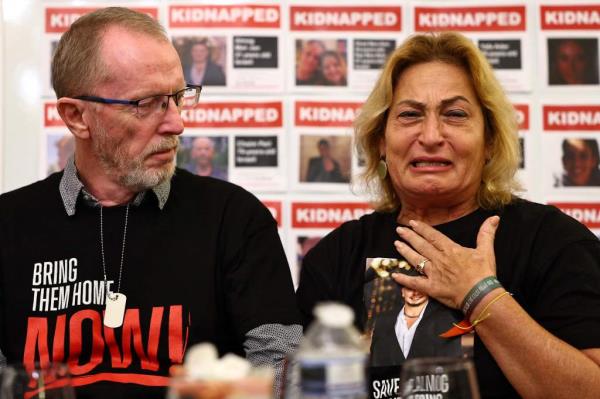 Orit Meir (R), mother of Almog Meir, cries next to Thomas Hand, father of Emily Hand, during a press co<em></em>nference by families of hostages held by Palestinian militant group Hamas in Gaza, at the embassy of Israel in Lo<em></em>ndon on November 20,