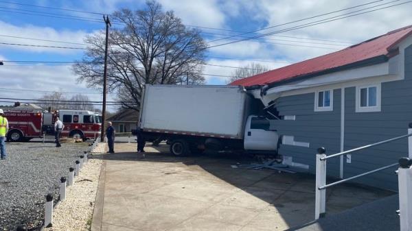 The box truck stuck in the church.