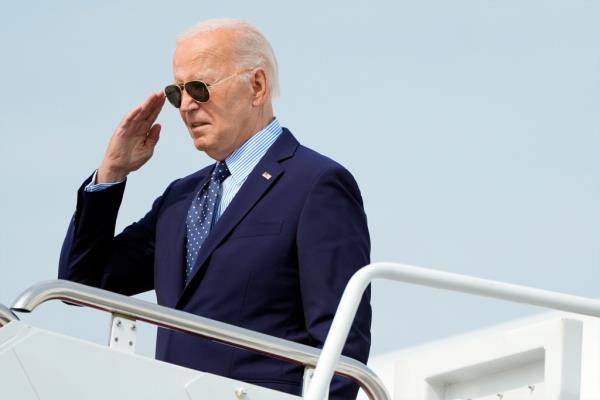 President Joe Biden salutes as he boards Air Force One at Joint ba<em></em>se Andrews, Md., on his way to Philadelphia, Friday, Aug. 16, 2024