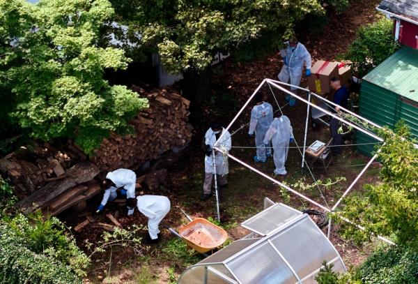 Cops search Rex Heuermann's backyard.