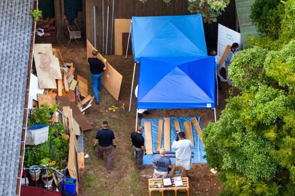 Cops search Rex Heuermann's backyard.