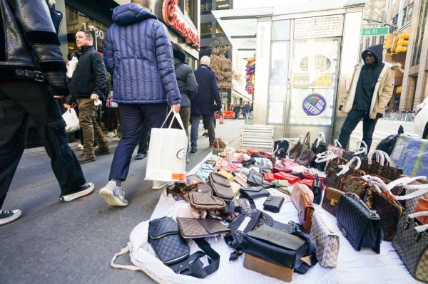 Vendors on Sixth Avenue selling luxury knockoffs.