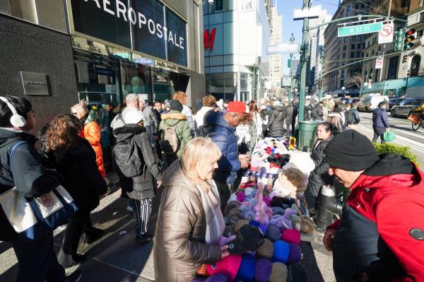 Vendors clog up the street near Macys.