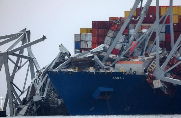 Wreckage lies across the deck of the Dali cargo vessel, which crashed into the Francis Scott Key Bridge causing it to collapse, in Baltimore, Maryland, U.S., March 27, 2024.