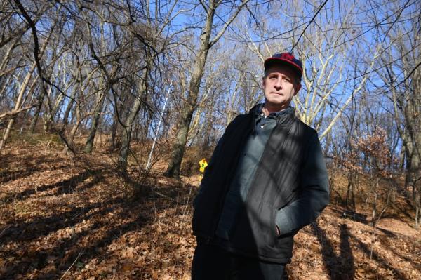 Joel Kuszai stands in Forest Park in Woodhaven wher<em></em>e he found a gun last week. 