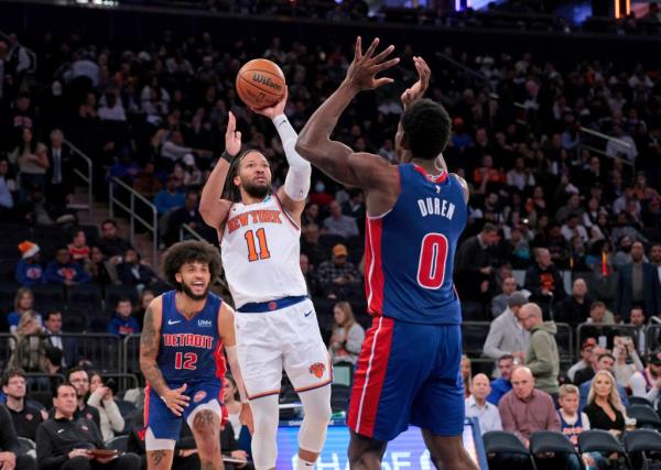 Jalen Brunson #11 puts up a shot as Detroit Pistons center Jalen Duren #0 defends during the third quarter.
