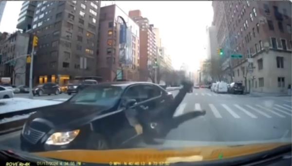 The moment Sahara Dula, driving the wrong way on Park Avenue, allegedly strikes an NYPD officer and sends him flying Wednesday 1/17 afternoon..