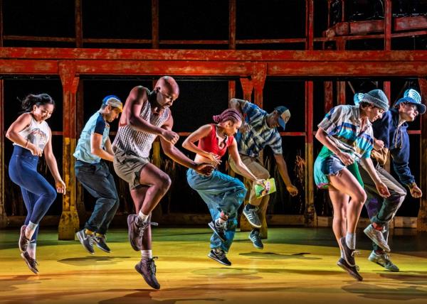 THe cast of Illinoise dancing