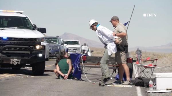 Police arrest demo<em></em>nstrators after ramming through their roadblock outside the Burning Man festival on Sunday