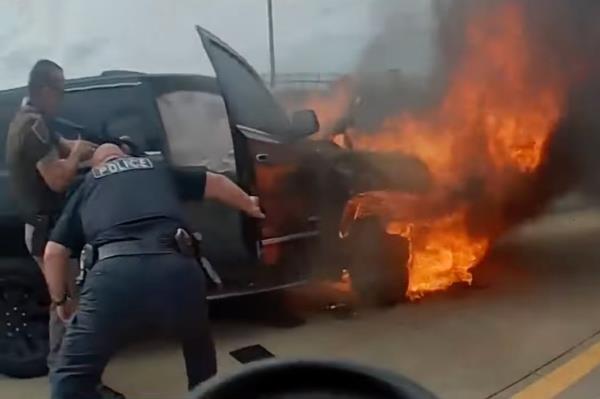The car in flames. 