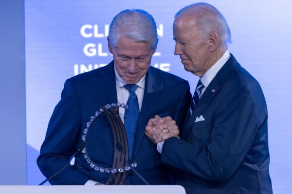 The Bidens and Clintons on stage 