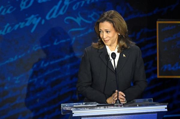 US Vice President Kamala Harris listening to former President Do<em></em>nald Trump speaking at a presidential debate, Philadelphia, 2024