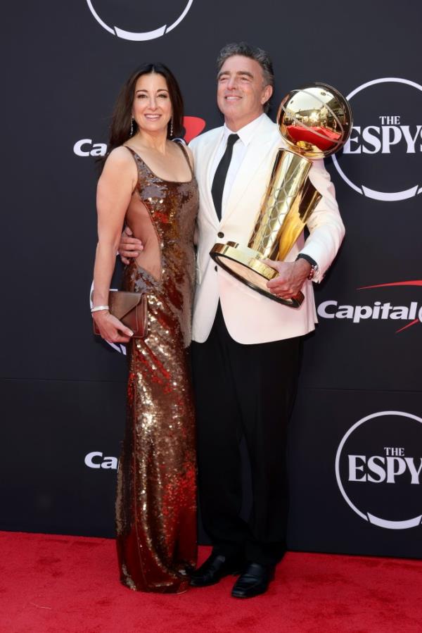 Celtics owner Wyc Grousbeck (r.) holds the Larry O'Brien Trophy alo<em></em>ngside wife Emilia Fazzalari (l.) at the ESPYs on July 11, 2024.