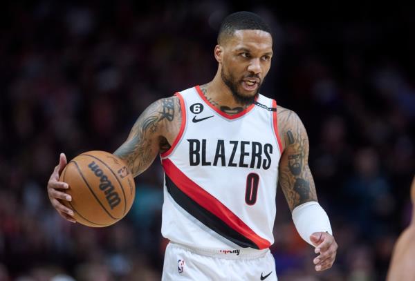 Portland Trail Blazers guard Damian Lillard brings the ball up against the New York Knicks during the second half of an NBA basketball game in Portland, Ore., Tuesday, March 14, 2023. Damian Lillard asked his team for a trade Saturday, July 1, a person with knowledge of the matter told The Associated Press.