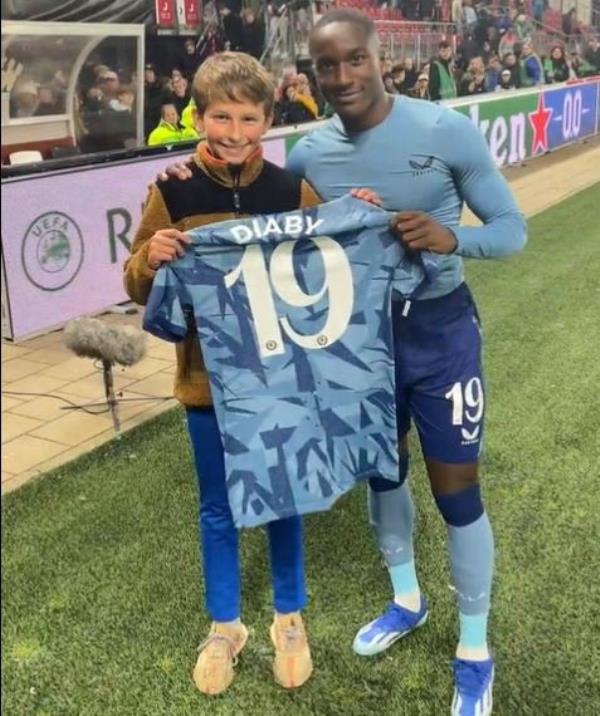 Young Aston Villa fan is left in tears as stadium steward co<em></em>nfiscates and bins his 'banned' handmade banner asking for his hero Moussa Diaby's shirt