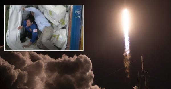 太空探索技术公司的“龙”号太空舱与来自四个国家的宇航员在国际空间站对接