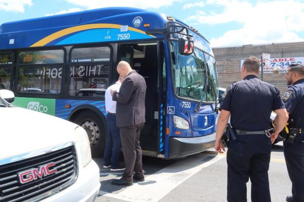 Police officers investigating the scene of the alleged stabbing on the bus in Brooklyn on June 8, 2024.