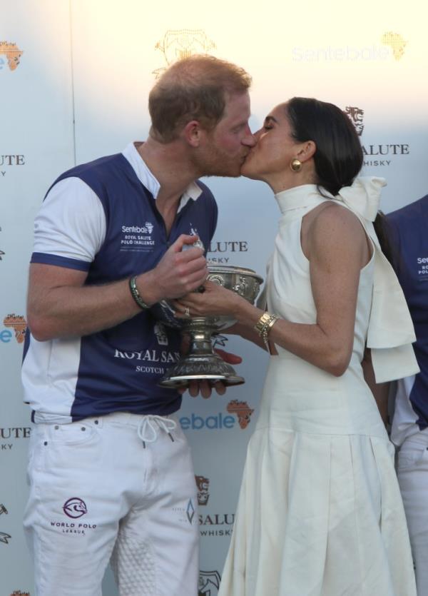 Prince Harry and Meghan Markle kiss at the Royal Salute Polo Challenge