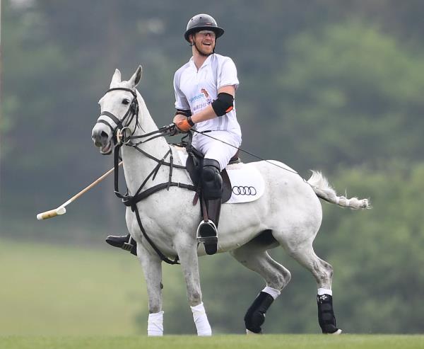 Prince Harry plays in the Audi Polo Challenge at Cowarth Polo Club in Ascot, Berkshire, UK, on the 6th May 2017.