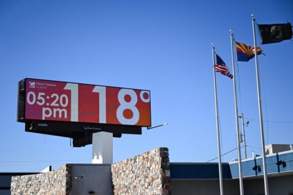 A billboard displays the temperature during a record heat wave in Phoenix, Arizona, in July