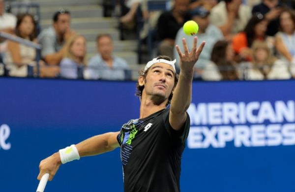 Lloyd Harris of South Africa, serves against Carlos Alcaraz 