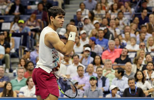 Carlos Alcaraz of Spain, reacts after winning a game against Lloyd Harris