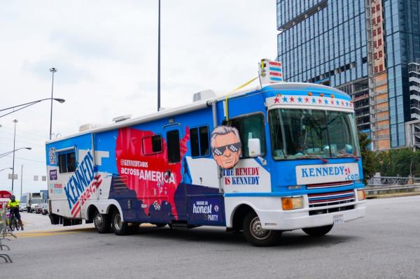 Supporters of presidential candidate Robert F. Kennedy Jr. drive an RV near the security perimeter near the CNN studio complex, site of tonight's presidential debate between President Joe Biden and Republican presidential candidate former President Do<em></em>nald Trump, Thursday, June 27, 2024, 