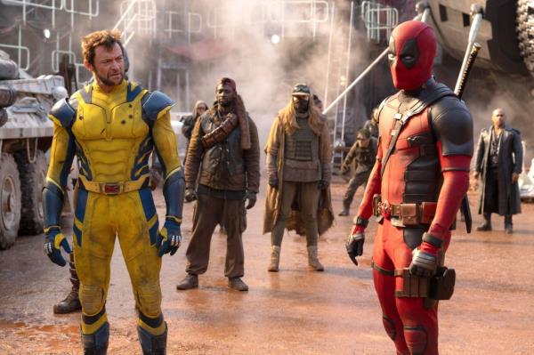 Wolverine and Deadpool in a factory like area