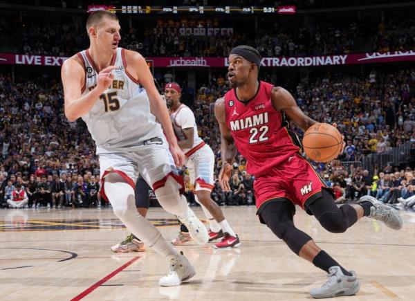 Jimmy Butler drives against Nikola Jokic during Game 5 of NBA Finals.