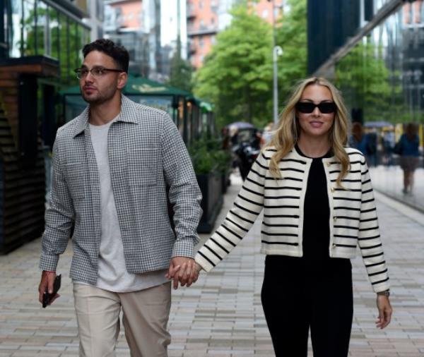 Adam Thomas and Caroline Thomas arrive at Wood Restaunt in Manchester City Centre 