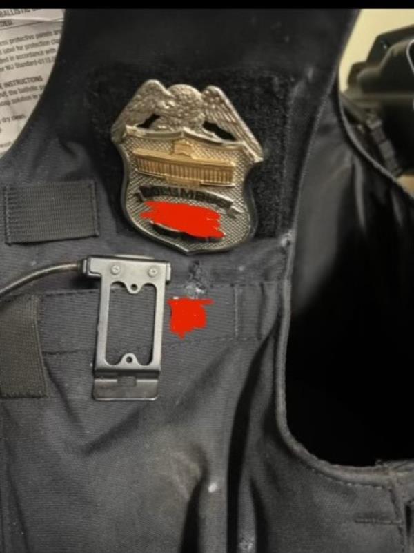 The Columbus police officer shot, identified o<em></em>nly as a four-year veteran of the department, suffered minor injuries due to his bulletproof vest absorbing the force of the bullet. 
