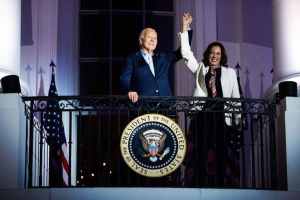 President Joe Biden and Vice President Kamala Harris standing on the Truman Balcony of the White House during Fourth of July celebration, 2024
