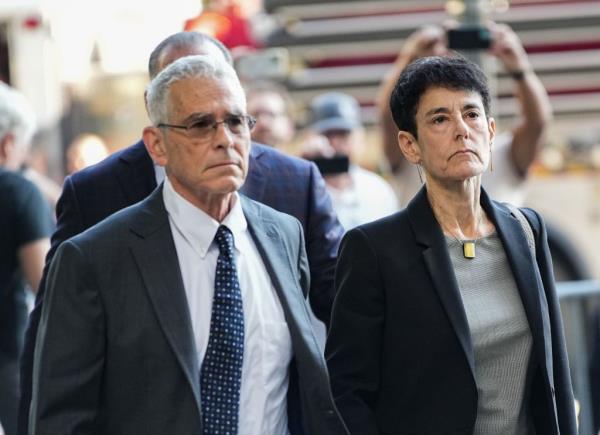Barbara Fried (pictured with Joseph Bankman) told her 31-year-old son to change out of his trademark cargo shorts and into pants to be arrested.
