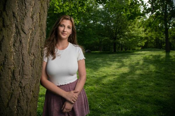 Julia Fatum poses up against a tree in Central Park this week. 