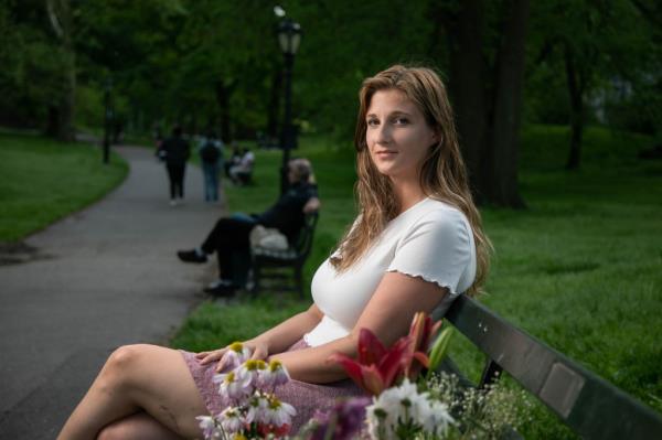 Julia Fatum poses on a bench at Central Park 