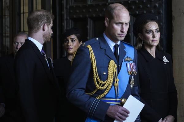 Prince William, Kate, Princess of Wales, Prince Harry, and Meghan, Duchess of Sussex, paying respects to Queen Elizabeth II in Westminster Hall, London