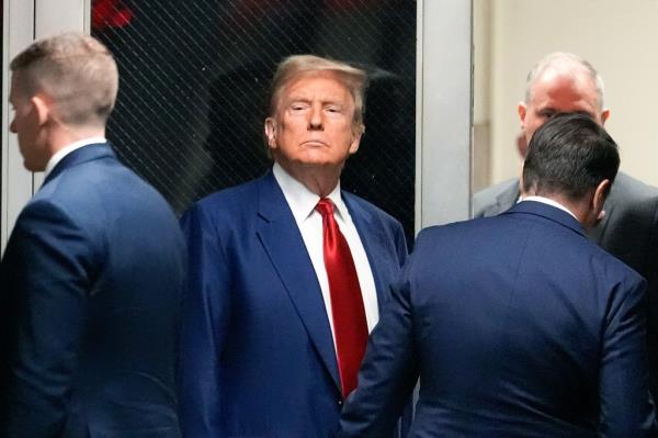 Do<em></em>nald Trump leaves the courtroom during a break in the pre-trial hearing in a hash mo<em></em>ney case in criminal court on March 25, 2024 in New York City.