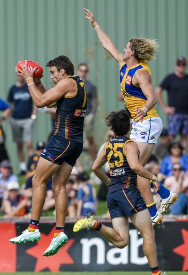 Riley Thilthorpe marks in front of  Callum Jamieson. 