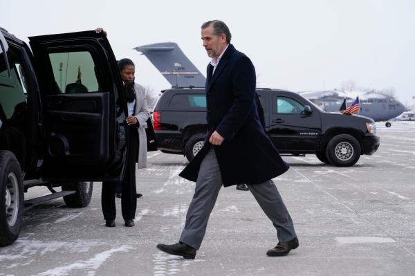 Hunter Biden, son of President Joe Biden, walks to a motorcade vehicle after stepping off Air Force One with President Biden.
