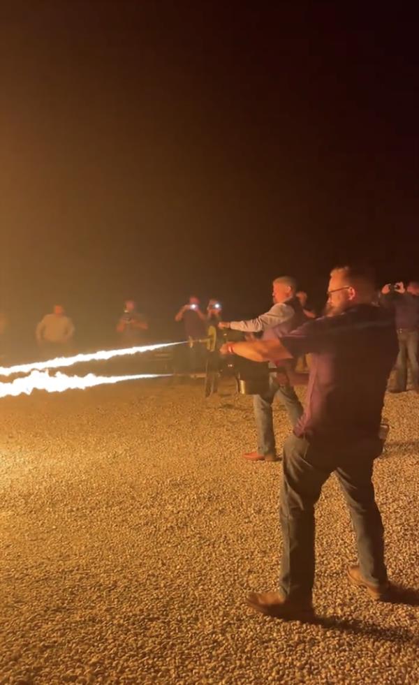 Missouri Sens. Bill Eigel and Nick Schroer can be seen firing flamethrowers at empty cardboard boxes. 