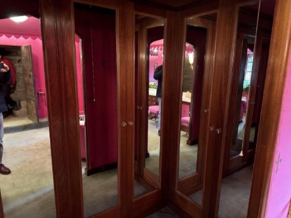 1970s wardrobes sub-divided from the Pink Bathroom, Hever Castle, Kent. Release date, 4/10/23. See SWNS story SWLSwardrobe. Hever Castle in Kent wants to restore the former Queen's bedroom to how it would have looked when she lived there as a child. To do so they will have to rip out built-in wardrobes installed by the hugely wealthy American Astor family in the 1970s. But because it is a Grade-I listed building the current owners will have to apply for planning permission.