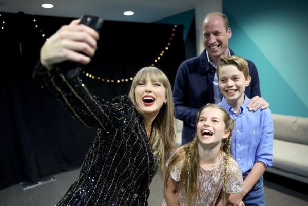 Swift, 34, smiling in a glittering black and silver blazer takes a selfie with Prince William and his two older kids.